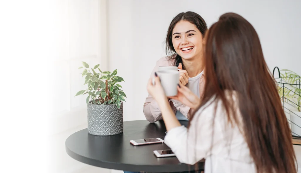 Two friends sharing a cup of tea